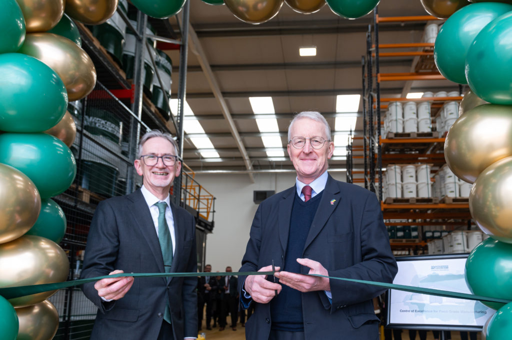 Peter Vickers and Hilary Benn, Labour MP for Leeds Central cutting the opening ribbon.